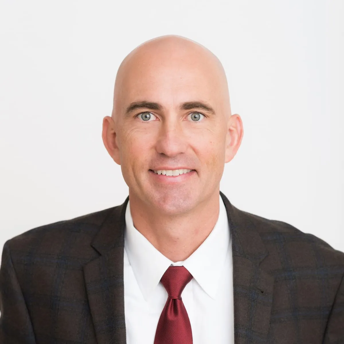 Dr. Daniel Monlux in a suit and tie